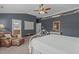 Spacious main bedroom with ensuite bathroom access and a plush reading chair at 2109 Hemlock Hill Dr, Durham, NC 27703
