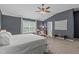 Main bedroom with dark walls, white bed, and lots of natural light at 2109 Hemlock Hill Dr, Durham, NC 27703