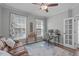 Comfortable office space with ample natural light, ceiling fan, and a cozy seating area at 2109 Hemlock Hill Dr, Durham, NC 27703