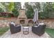 Outdoor fireplace with seating area for relaxing and entertaining at 2109 Hemlock Hill Dr, Durham, NC 27703