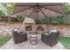 Outdoor fireplace with seating area for relaxing and entertaining at 2109 Hemlock Hill Dr, Durham, NC 27703