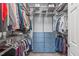This walk-in closet features built-in shelving, hanging rods, and drawers for optimal storage at 2109 Hemlock Hill Dr, Durham, NC 27703