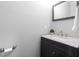 Stylish powder room with a modern vanity and a decorative mirror at 2113 Conroy Way, Willow Springs, NC 27592