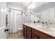 Bathroom features a double sink vanity with a shower-tub combination at 2113 Conroy Way, Willow Springs, NC 27592