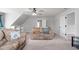 Bonus room with built in shelving and a sitting area at 2113 Conroy Way, Willow Springs, NC 27592