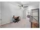 Bonus room featuring a ceiling fan, gray carpet and rustic wood shelving at 2113 Conroy Way, Willow Springs, NC 27592