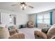 Bonus room featuring a sitting area, ceiling fan and lots of natural light at 2113 Conroy Way, Willow Springs, NC 27592