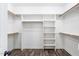Walk-in closet with custom shelving and wood flooring, perfect for organization at 2113 Conroy Way, Willow Springs, NC 27592