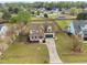 Charming two-story home with a well-manicured lawn, front porch, and an attached two-car garage at 2113 Conroy Way, Willow Springs, NC 27592