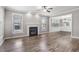 Inviting living room with a cozy fireplace and an abundance of natural light at 2113 Conroy Way, Willow Springs, NC 27592