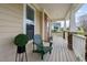 Inviting front porch with comfortable seating and decorative potted plants at 2113 Conroy Way, Willow Springs, NC 27592