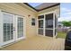 Attached screened-in porch leads to deck and backyard area at 2113 Conroy Way, Willow Springs, NC 27592