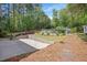 A beautiful backyard boasts an above ground pool, shed, landscaping, and privacy fence at 2120 Hillock Dr, Raleigh, NC 27612