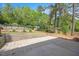 Landscaped backyard with an above ground pool, shed, and privacy fence at 2120 Hillock Dr, Raleigh, NC 27612