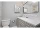 Bathroom features a modern sink and vanity, updated lighting and large mirror at 2120 Hillock Dr, Raleigh, NC 27612
