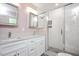 Updated bathroom features double sinks, stone countertops, and walk-in shower at 2120 Hillock Dr, Raleigh, NC 27612