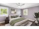 Bedroom with hardwood floors and three windows at 2120 Hillock Dr, Raleigh, NC 27612