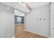 Hallway featuring shiplap accent wall, light wood flooring, and view into adjacent room at 2120 Hillock Dr, Raleigh, NC 27612