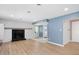 Living room features a fireplace, wood plank floors, and easy access to the outside at 2120 Hillock Dr, Raleigh, NC 27612