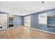 Spacious living room boasts wood floors, fresh paint, backyard access, and staircase at 2120 Hillock Dr, Raleigh, NC 27612