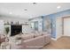 Staged living room with a cozy fireplace, a pink sofa, and a neutral color palette at 2120 Hillock Dr, Raleigh, NC 27612