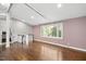 Bright living space features hardwood floors, recessed lighting, and large windows offering plenty of natural light at 2120 Hillock Dr, Raleigh, NC 27612