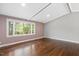 Bright living space features hardwood floors and large windows that provide lots of natural light at 2120 Hillock Dr, Raleigh, NC 27612