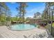 Above ground pool with a deck, surrounded by mature shade trees in backyard at 2120 Hillock Dr, Raleigh, NC 27612