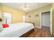 Bedroom featuring hardwood floors, a ceiling fan, and two closets at 2124 Castle Pines Dr, Raleigh, NC 27604