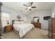 Bedroom showcasing a large window, ceiling fan and dresser, providing a bright and airy feel at 2124 Castle Pines Dr, Raleigh, NC 27604