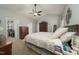 Spacious bedroom featuring neutral tones, ceiling fan, and walk-in closet at 2124 Castle Pines Dr, Raleigh, NC 27604