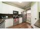 Well-lit kitchen boasts stainless steel appliances, stylish countertops, and ample cabinet space at 2124 Castle Pines Dr, Raleigh, NC 27604