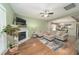 Cozy living room with a fireplace, tv, neutral color palette and a large comfortable couch at 2124 Castle Pines Dr, Raleigh, NC 27604