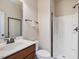 Clean bathroom with a stand-up shower and a wood-trimmed vanity at 2125 Toad Hollow Trl, Apex, NC 27502