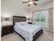 Comfortable bedroom with a large window and soft, floral-patterned accents at 2125 Toad Hollow Trl, Apex, NC 27502