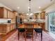Well-equipped kitchen featuring stainless steel appliances, center island, and a cozy dining area with backyard access at 2125 Toad Hollow Trl, Apex, NC 27502