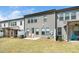 Backyard featuring well-maintained lawn and a concrete patio perfect for outdoor seating at 2129 Mars Hill Ln, Apex, NC 27502
