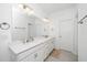 Bright bathroom featuring dual sinks with quartz countertops and modern fixtures at 2129 Mars Hill Ln, Apex, NC 27502