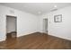 Empty bedroom with hardwood floors and bright lighting at 2129 Mars Hill Ln, Apex, NC 27502