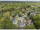 A high aerial view of a landscaped neighborhood featuring mature trees and well maintained lawns at 213 Lewiston Ct, Cary, NC 27513