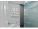 Modern bathroom featuring a glass-enclosed shower and window with white shutters at 213 Lewiston Ct, Cary, NC 27513