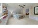 Charming bedroom featuring built-in shelving, a comfy bed, and an adjoining living space at 213 Lewiston Ct, Cary, NC 27513