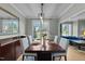 Bright dining room with hardwood floors, a large window, and views of the front yard at 213 Lewiston Ct, Cary, NC 27513