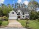 Beautiful two-story home boasts mature trees, a lush green lawn, and a serene neighborhood setting at 213 Lewiston Ct, Cary, NC 27513