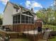 Exterior view of multi-level deck with screened porch and backyard at 213 Lewiston Ct, Cary, NC 27513
