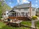 View of back of house featuring a multi-level deck and screened porch at 213 Lewiston Ct, Cary, NC 27513