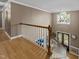 Welcoming foyer features hardwood floors, white staircase and trim, and a decorative front door with sidelights at 213 Lewiston Ct, Cary, NC 27513