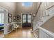 Welcoming foyer with hardwood floors, a staircase, and a decorative double door entry at 213 Lewiston Ct, Cary, NC 27513