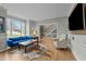 Cozy living room with hardwood floors, a large window, and neutral colored walls at 213 Lewiston Ct, Cary, NC 27513