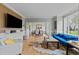 Open living room with hardwood floors, a large window, and a view into the dining room at 213 Lewiston Ct, Cary, NC 27513